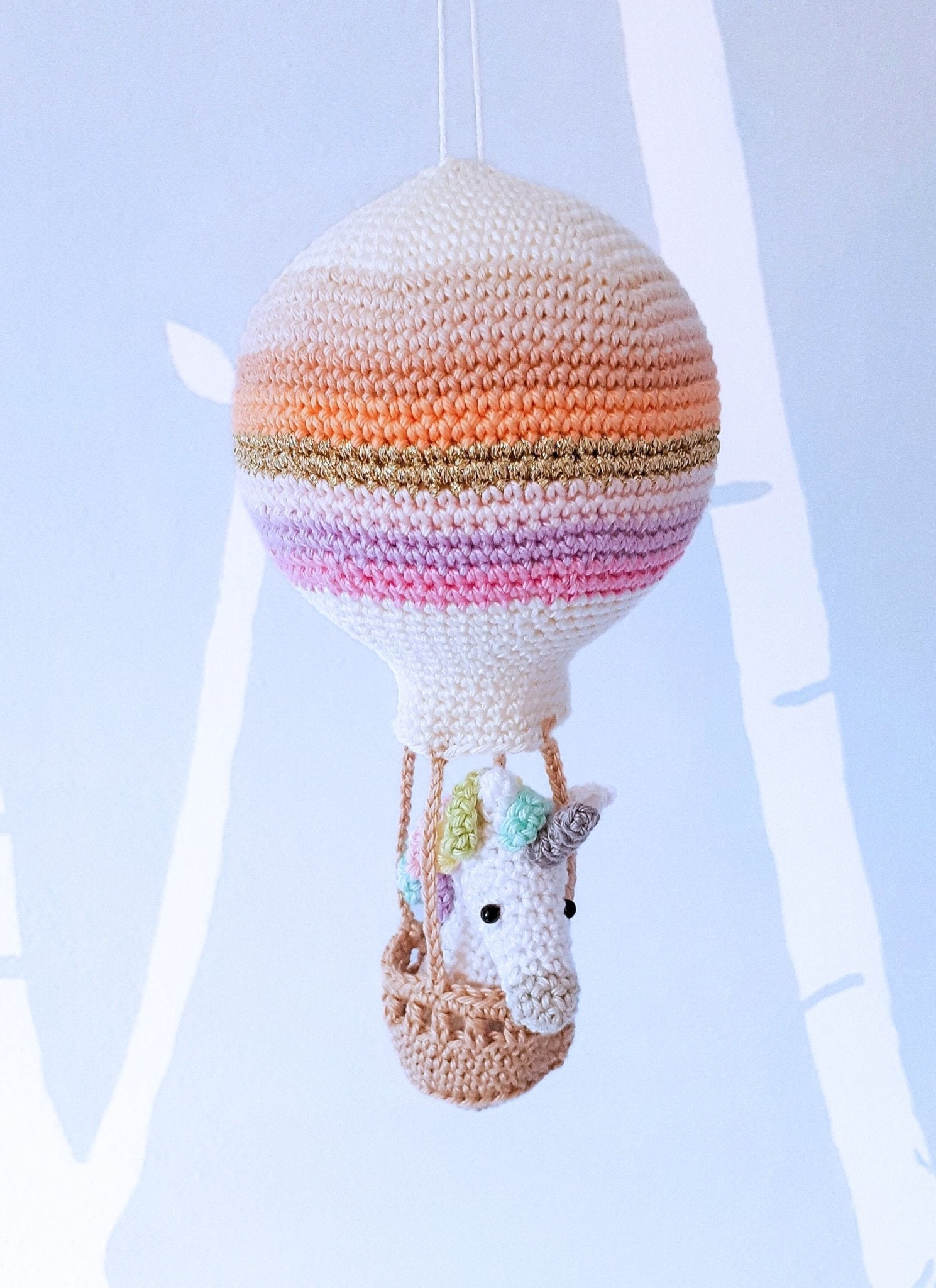 Crochet pattern amigurumi unicorn in a hot air balloon - Crochet on a tree