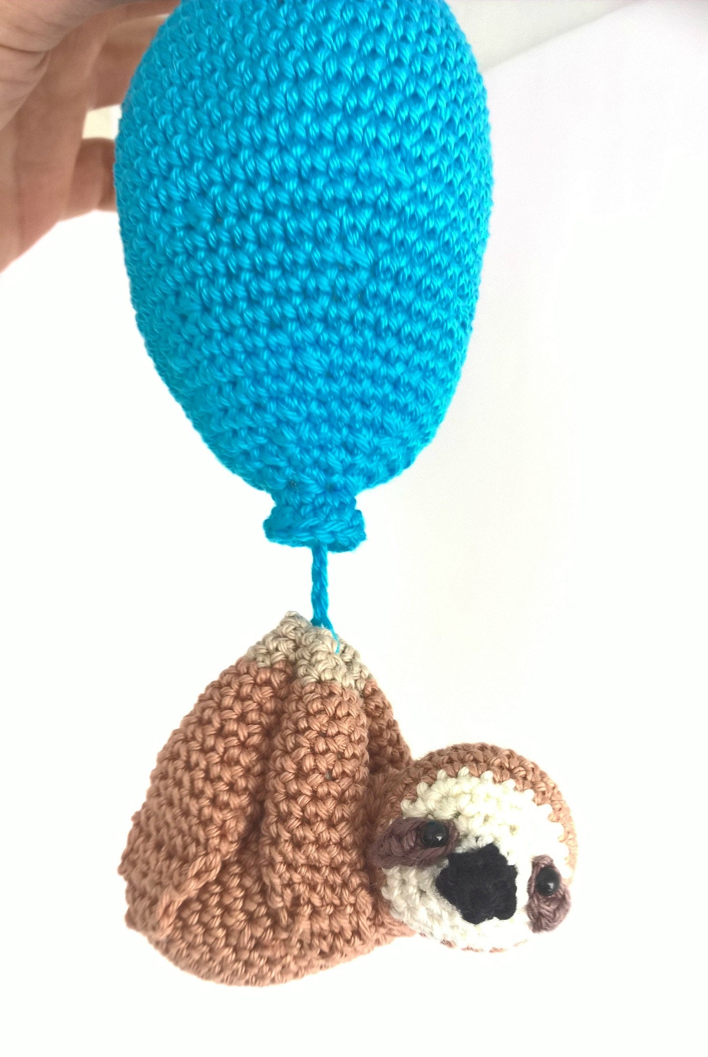 Crochet sloth with balloon